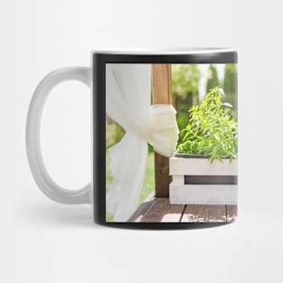 White wooden pot with green herbs on a wooden terrace Mug